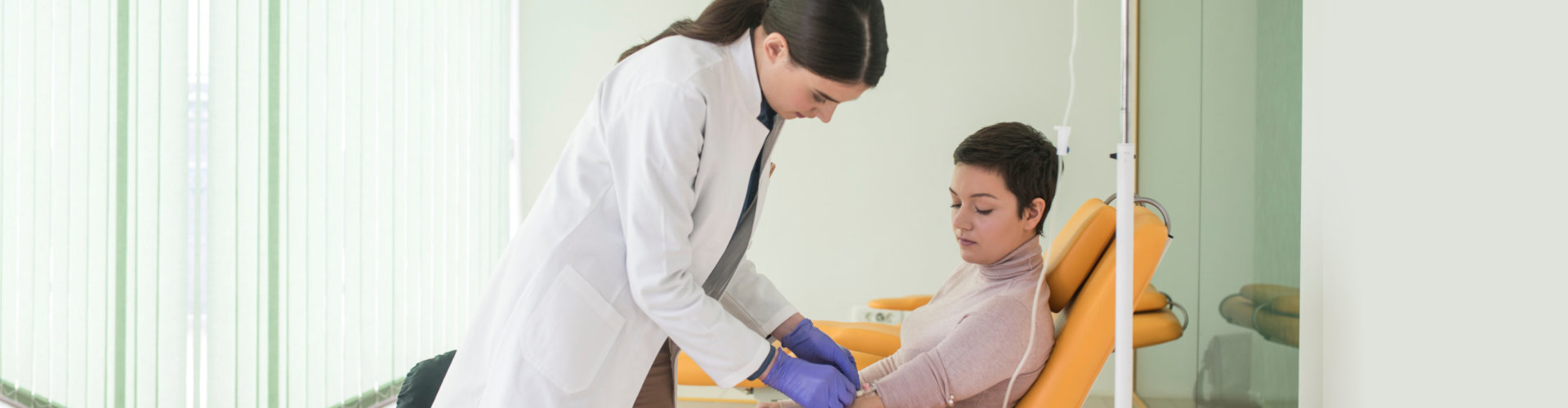 female doctor assisting woman
