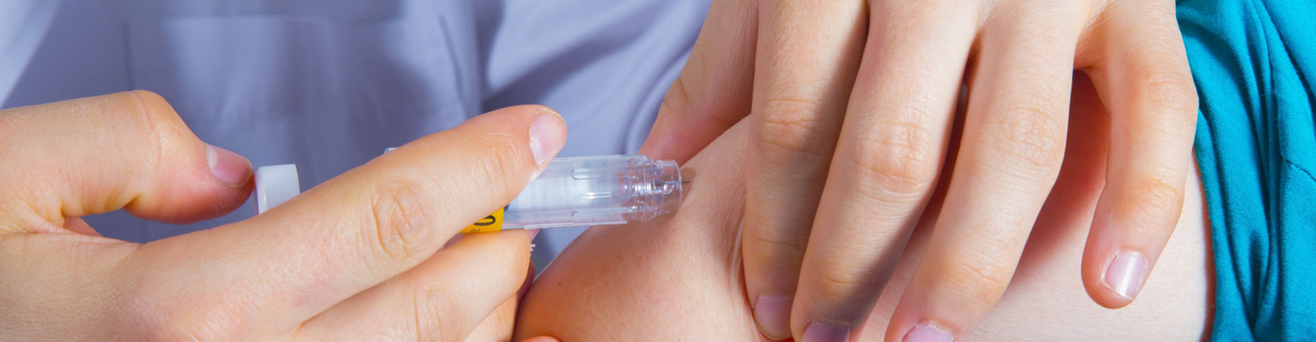 nurse giving intravenous therapy